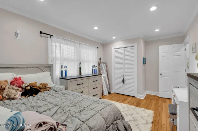 a bedroom with a bed and a lamp