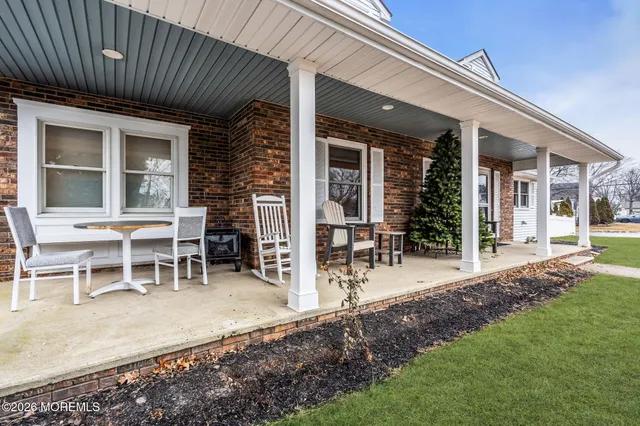 a view of a backyard with a patio and a garden