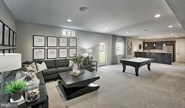 a living room with furniture and a table
