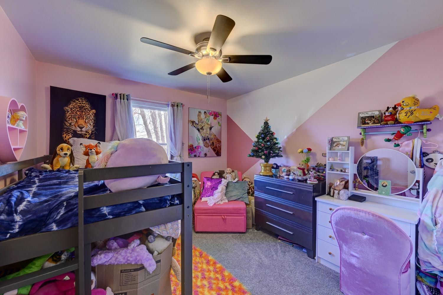 12134 North 332E Thayer, IN 46381 - Photo 11 of 16 a bed room with a bed closet and a mirror