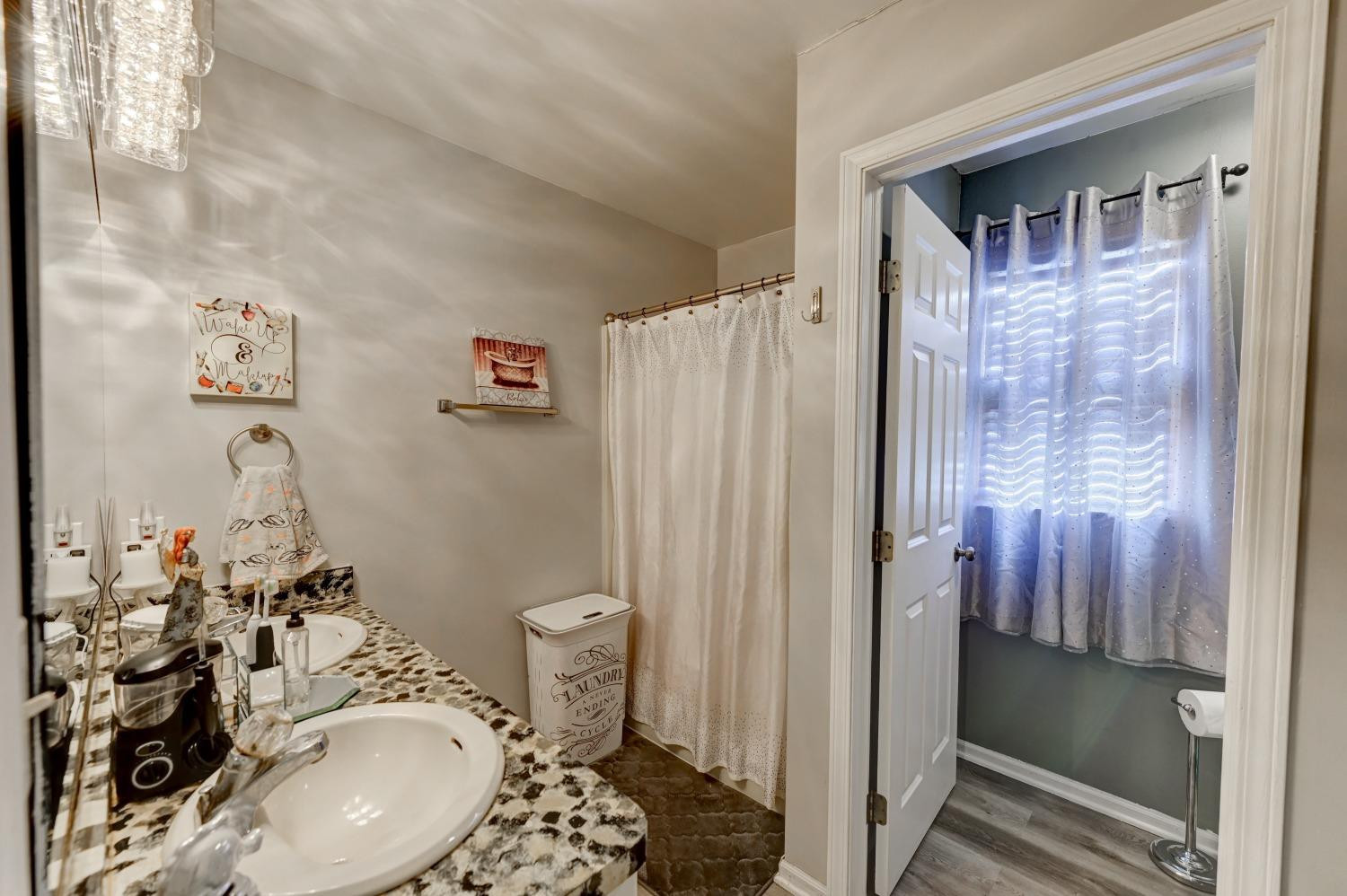 12134 North 332E Thayer, IN 46381 - Photo 7 of 16 a bathroom with a sink toilet and shower