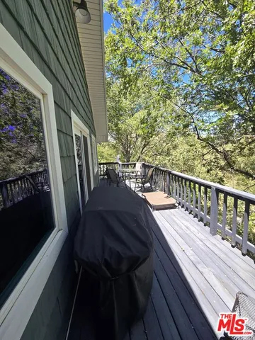 a view of balcony with furniture