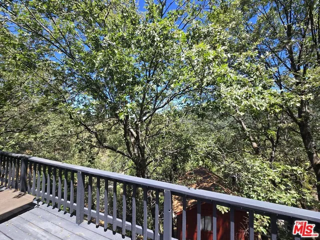 a balcony with wooden fence