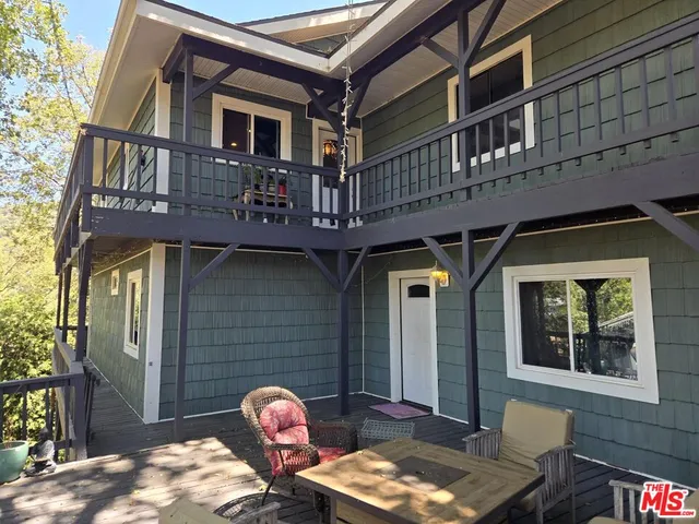 a front view of a house with parking space