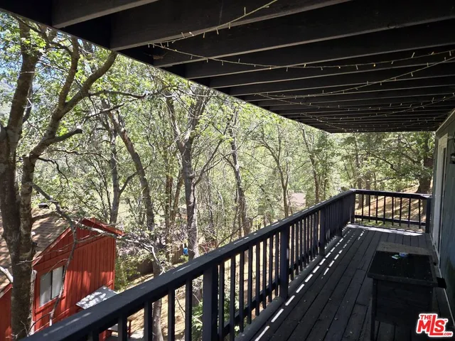 a view of balcony with wooden floor