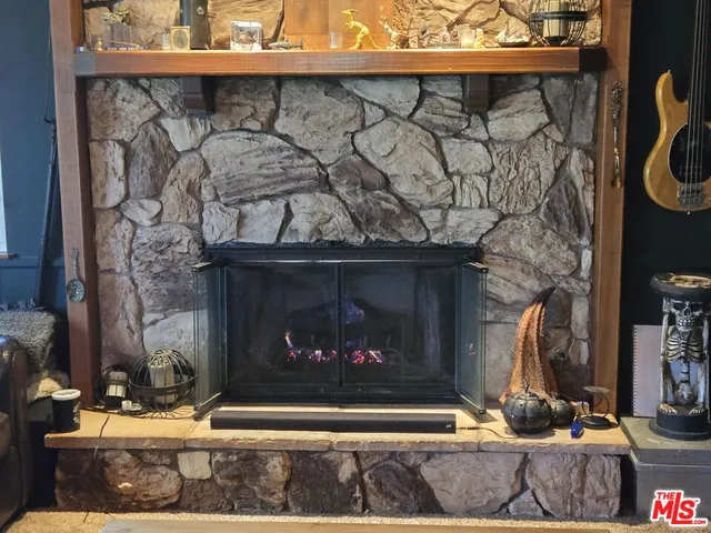 a room with fireplace and wooden floor