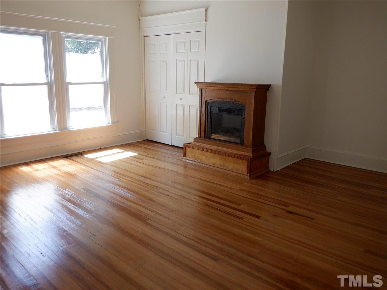 1516 Bahama Road Bahama, NC 27503 - Photo 11 of 25 Beautiful wood floors and electric fireplace