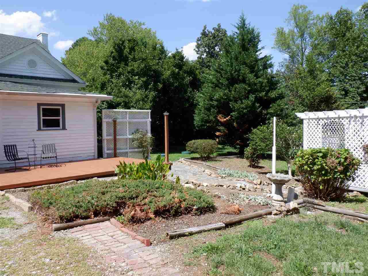 1516 Bahama Road Bahama, NC 27503 - Photo 18 of 25 Private back yard offers deck, patio, and gazebo
