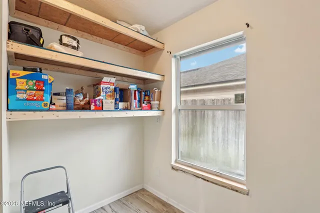 a view of a livingroom with a refrigerator