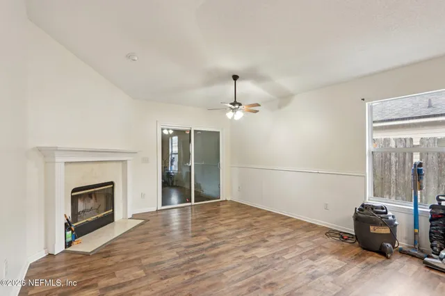 a view of livingroom with hardwood floor and a fireplace
