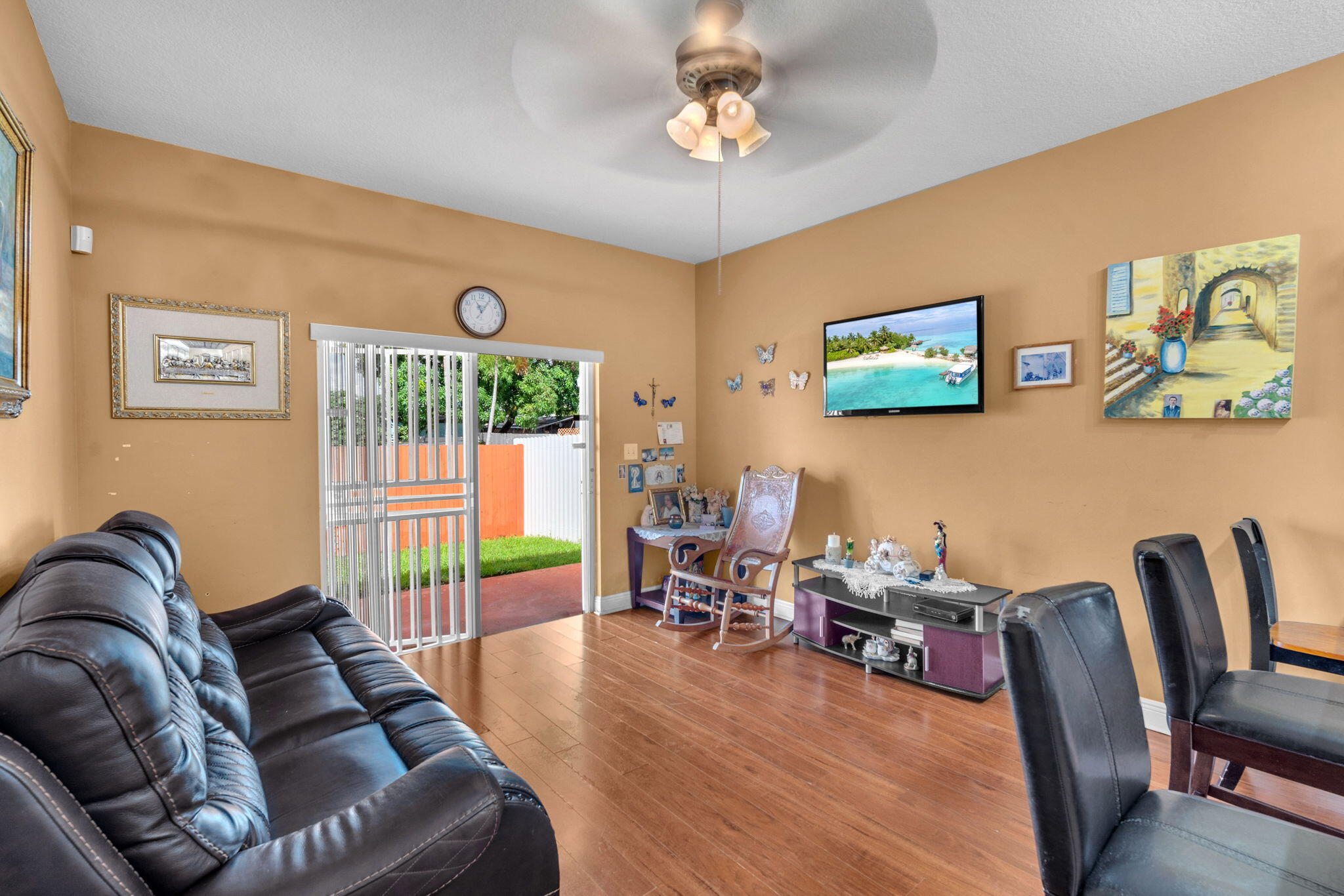 1395 West 30th Street Hialeah, FL 33012 - Photo 11 of 26 a living room with furniture and a flat screen tv