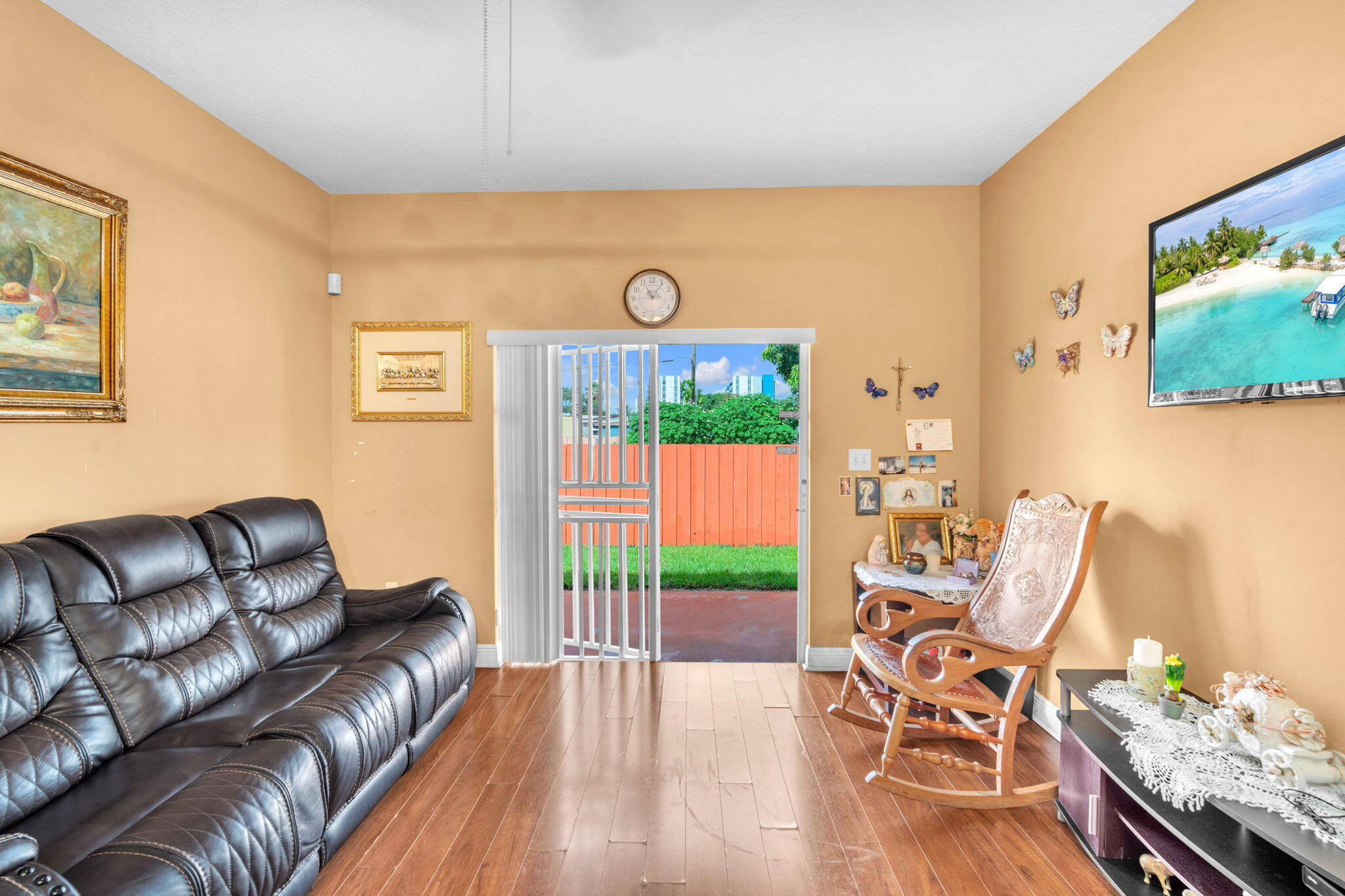 1395 West 30th Street Hialeah, FL 33012 - Photo 12 of 26 a living room with furniture and a flat screen tv