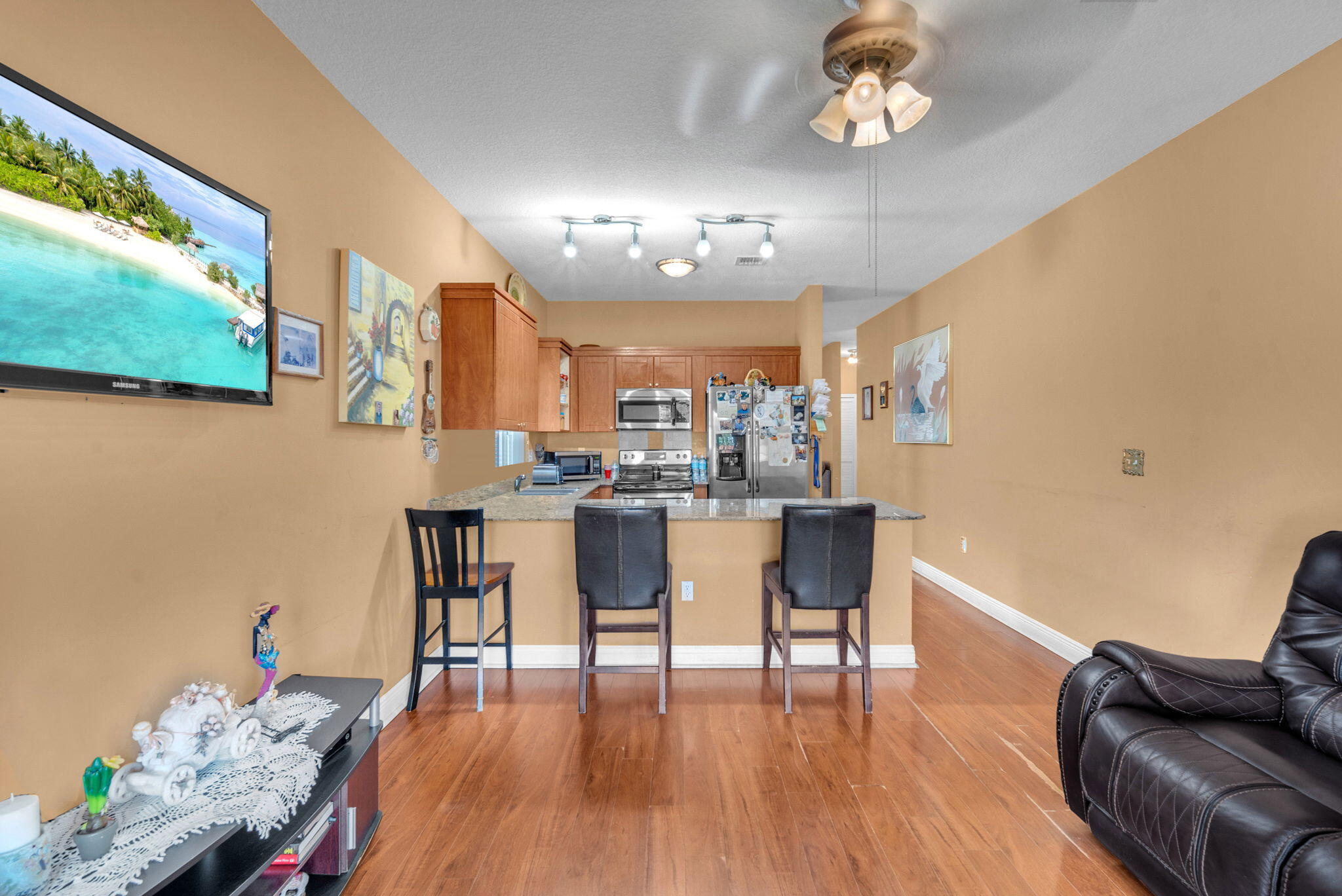 1395 West 30th Street Hialeah, FL 33012 - Photo 13 of 26 a view of a dining room with furniture and wooden floor