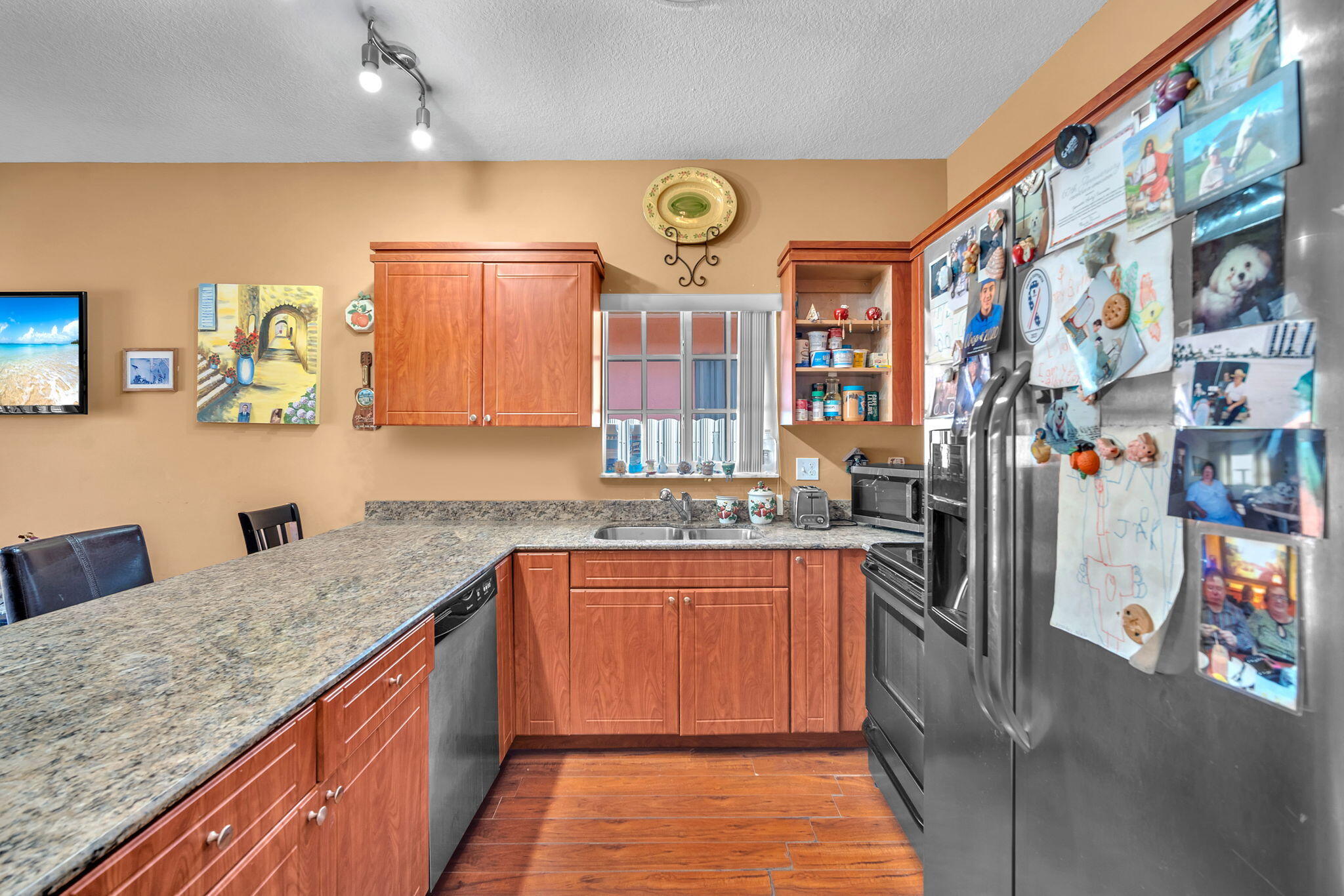 1395 West 30th Street Hialeah, FL 33012 - Photo 15 of 26 a kitchen with stainless steel appliances granite countertop a sink and cabinets