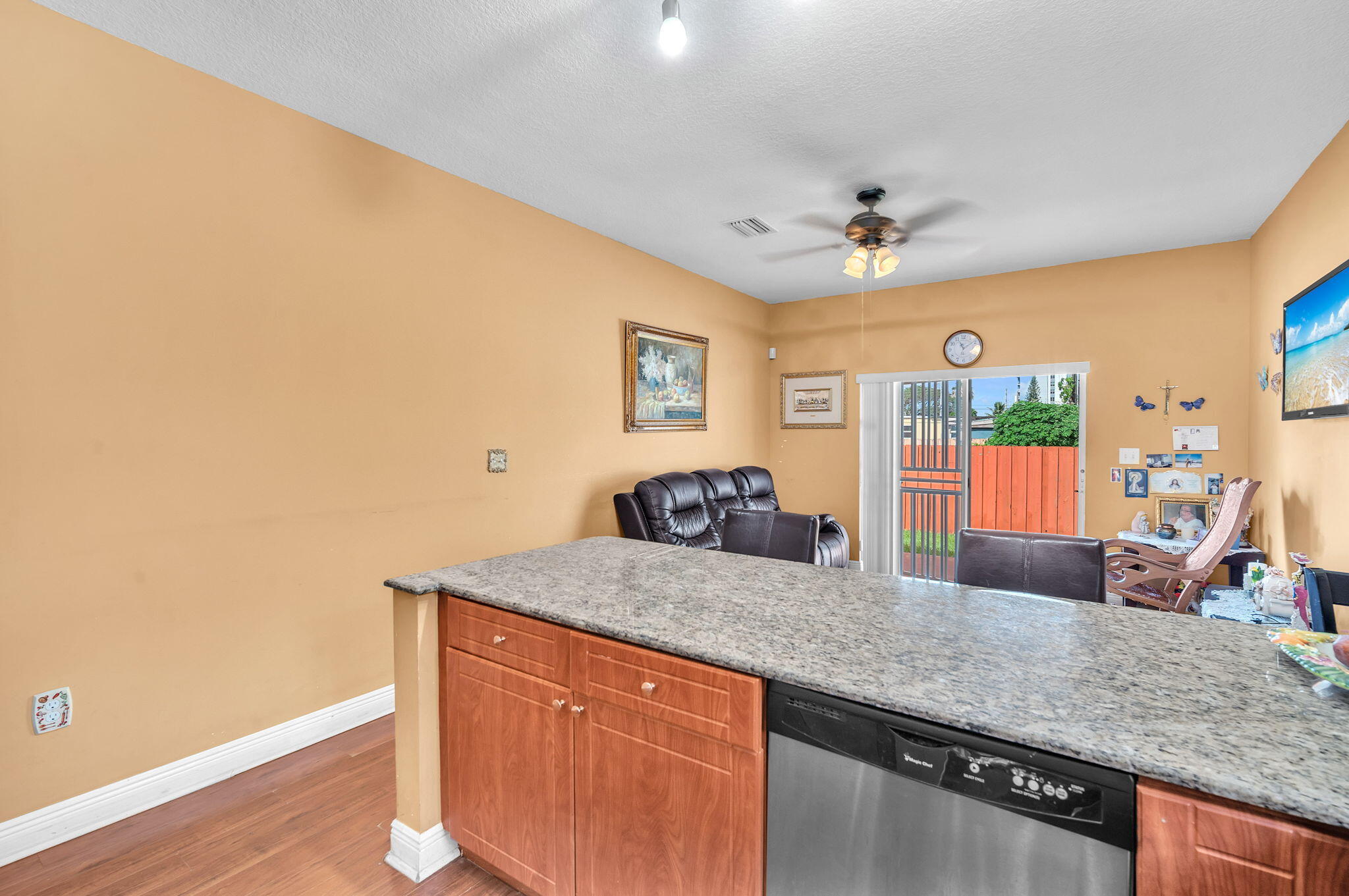 1395 West 30th Street Hialeah, FL 33012 - Photo 16 of 26 a kitchen with stainless steel appliances granite countertop a sink and a granite counter tops with white cabinets