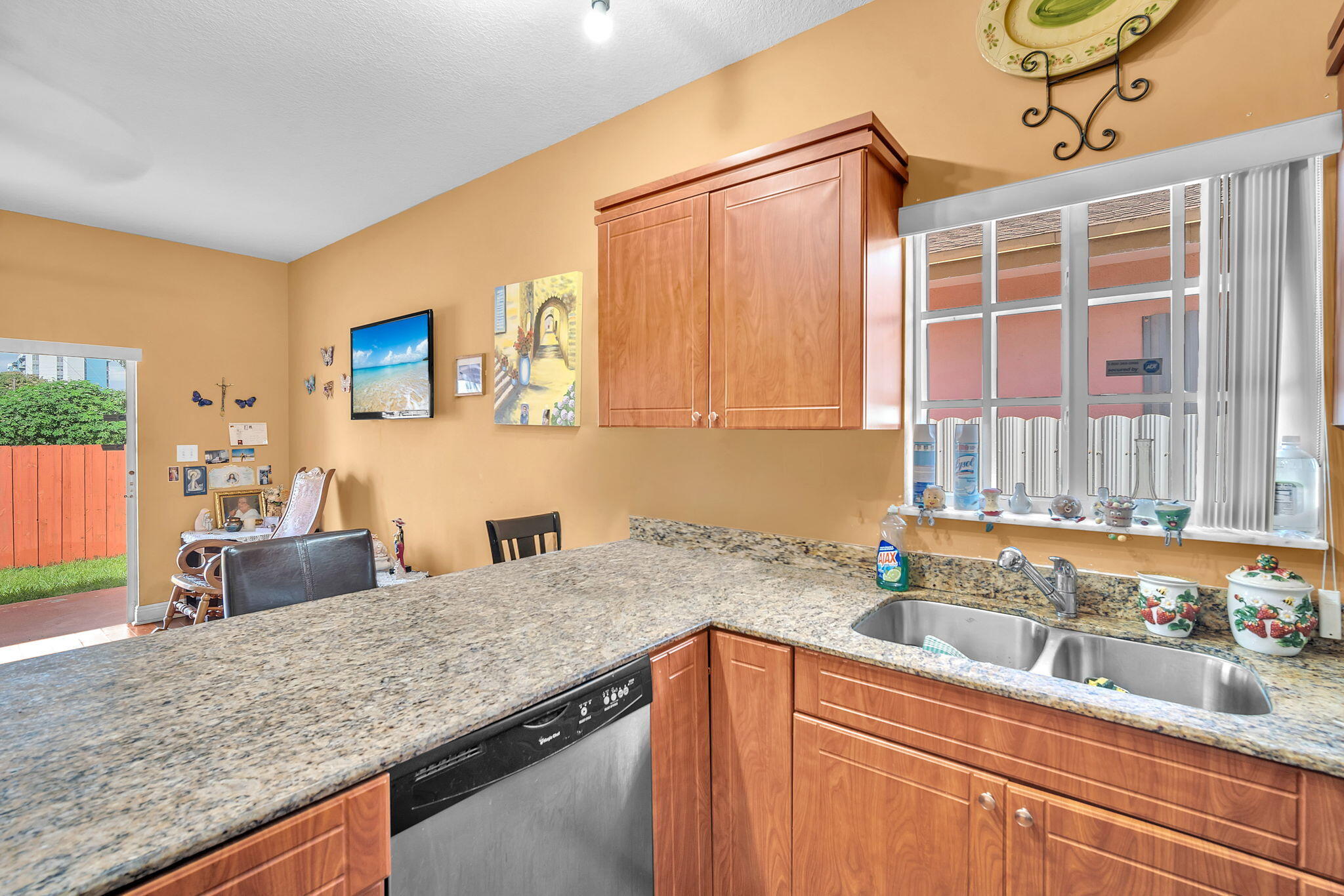 1395 West 30th Street Hialeah, FL 33012 - Photo 17 of 26 a kitchen with stainless steel appliances granite countertop a sink and a granite counter tops with wooden floors