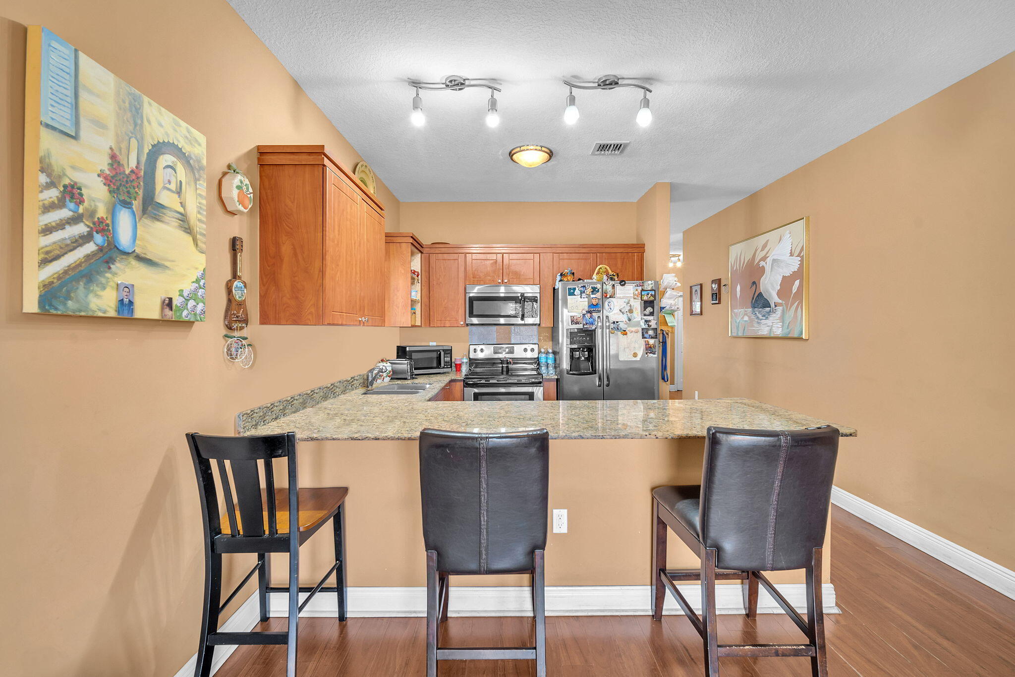 1395 West 30th Street Hialeah, FL 33012 - Photo 18 of 26 a kitchen with a dining table chairs and large window