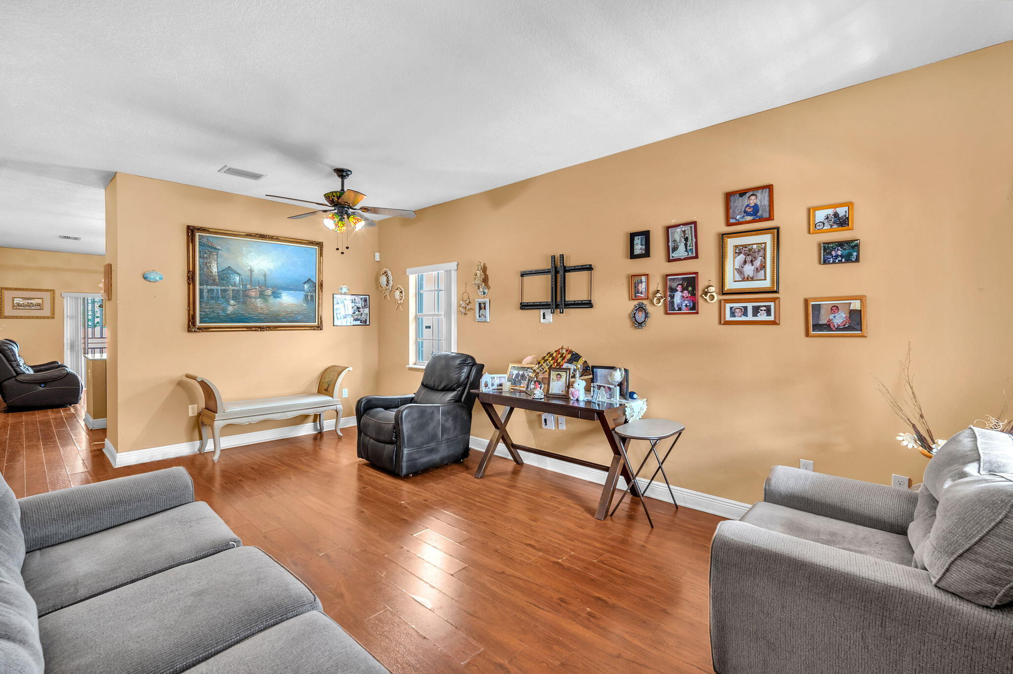 1395 West 30th Street Hialeah, FL 33012 - Photo 20 of 26 a living room with furniture and painting on the wall