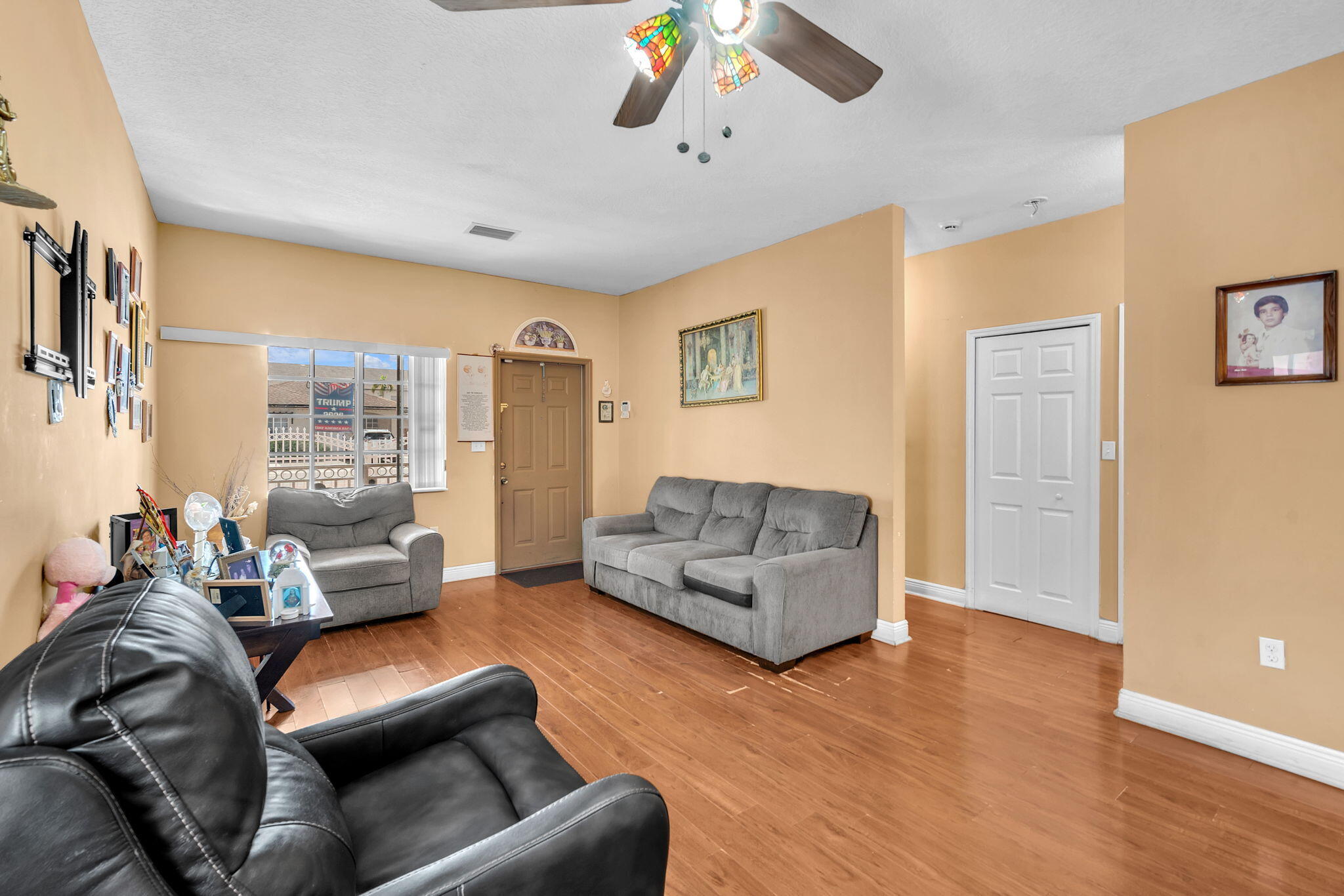 1395 West 30th Street Hialeah, FL 33012 - Photo 21 of 26 a living room with furniture and a couch