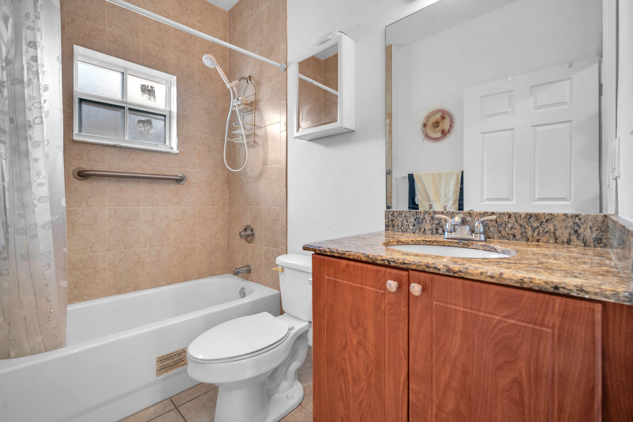 1395 West 30th Street Hialeah, FL 33012 - Photo 22 of 26 a bathroom with a granite countertop sink toilet and shower