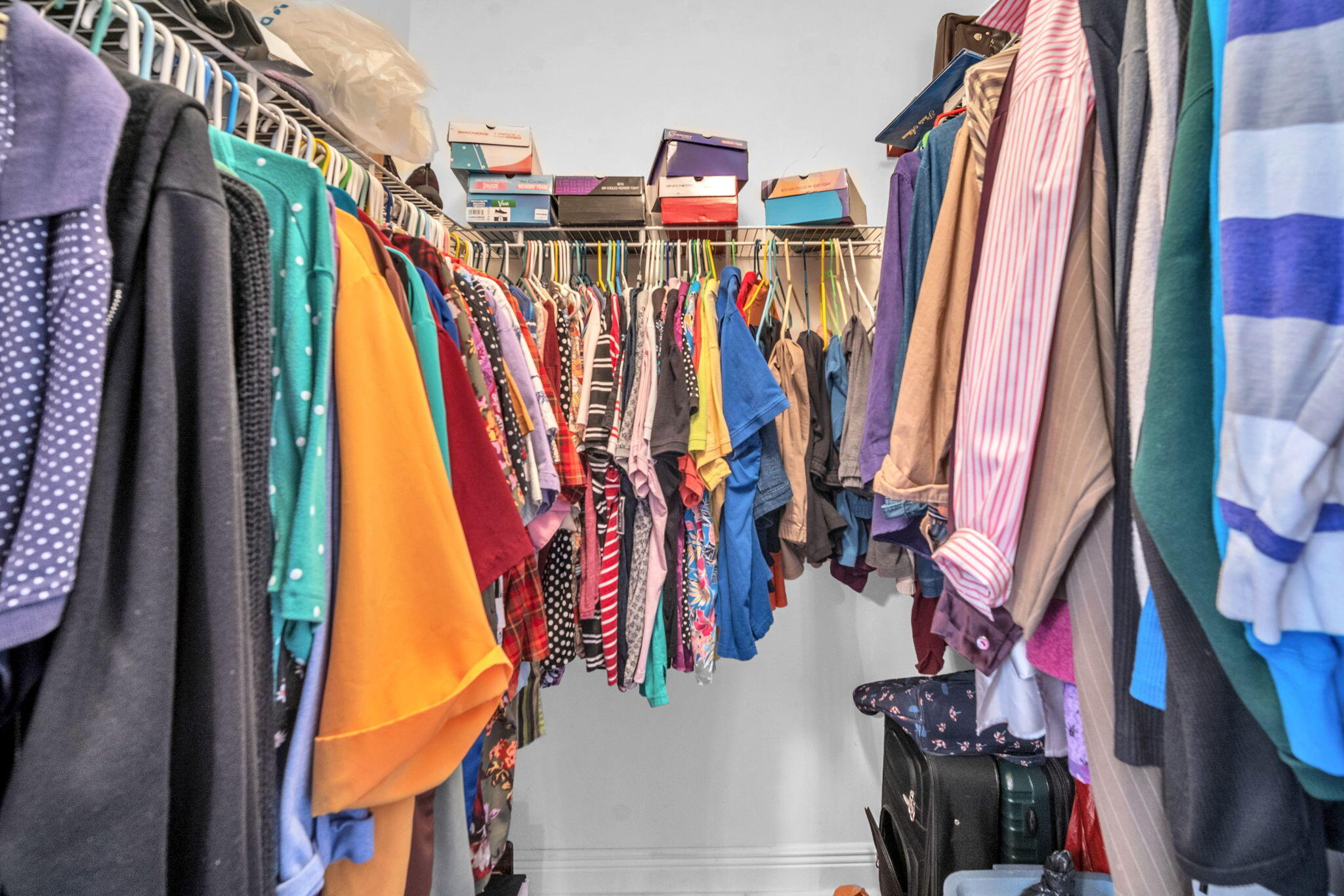 1395 West 30th Street Hialeah, FL 33012 - Photo 25 of 26 a view of walk in closet with clothes