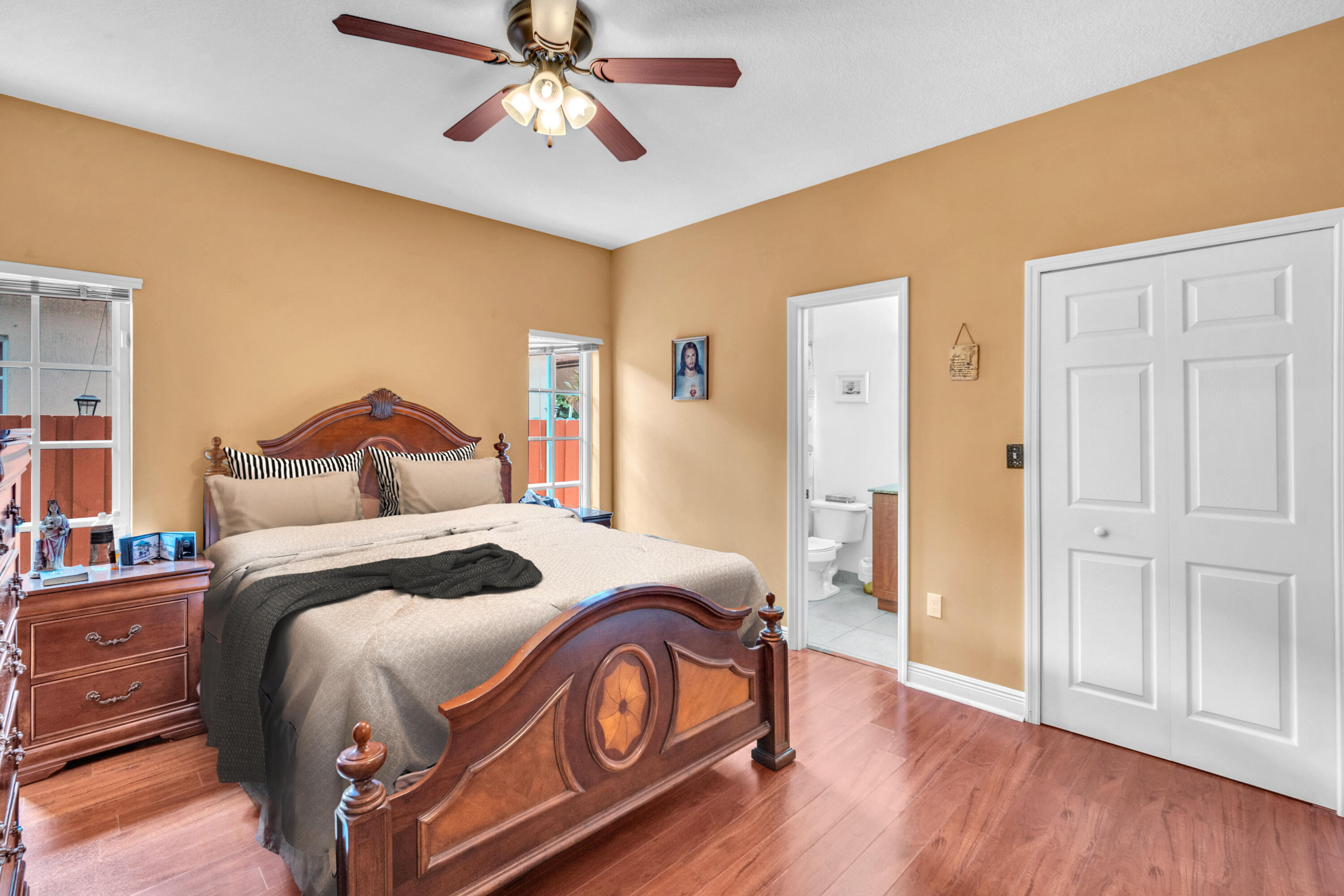 1395 West 30th Street Hialeah, FL 33012 - Photo 4 of 26 a bedroom with a bed and wooden floor