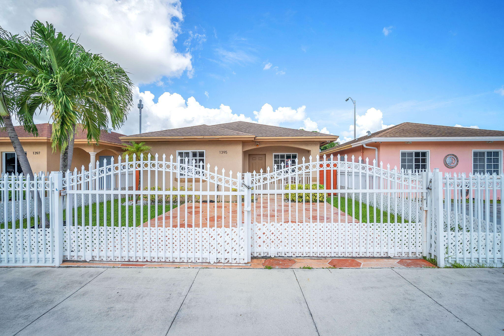 1395 West 30th Street Hialeah, FL 33012 - Photo 7 of 26 a view of front of a house with a porch