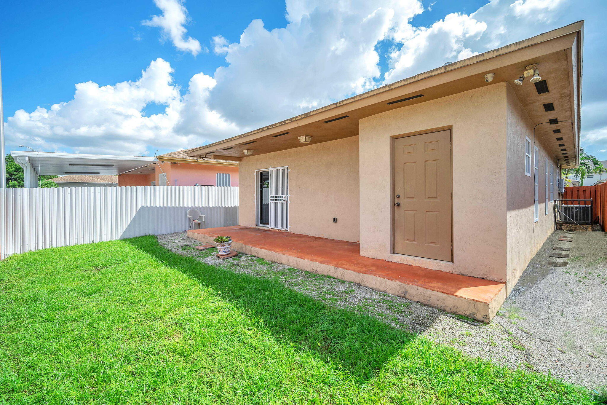 1395 West 30th Street Hialeah, FL 33012 - Photo 10 of 26 a backyard of a house with lots of green space
