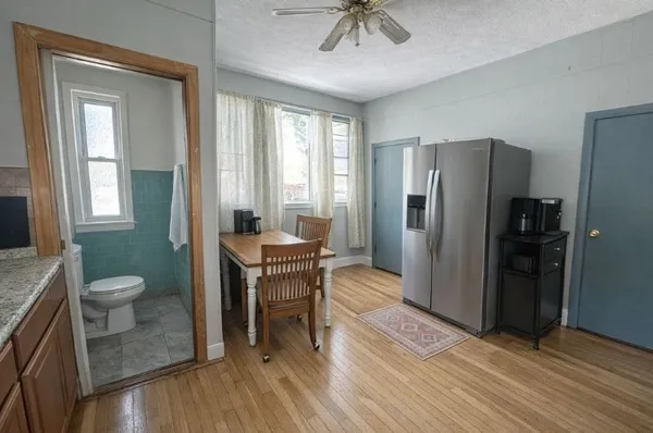 a bathroom with a sink toilet and a mirror