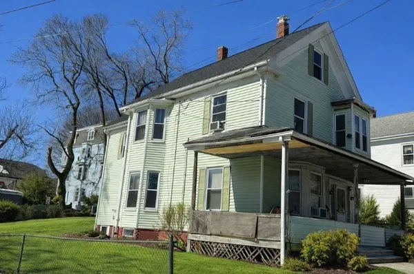 front view of a house with a yard
