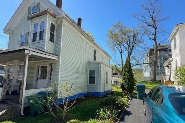 a front view of a house with garden
