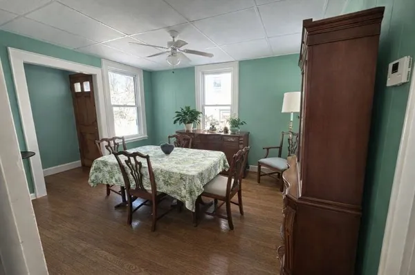 a view of a dining room with furniture and window
