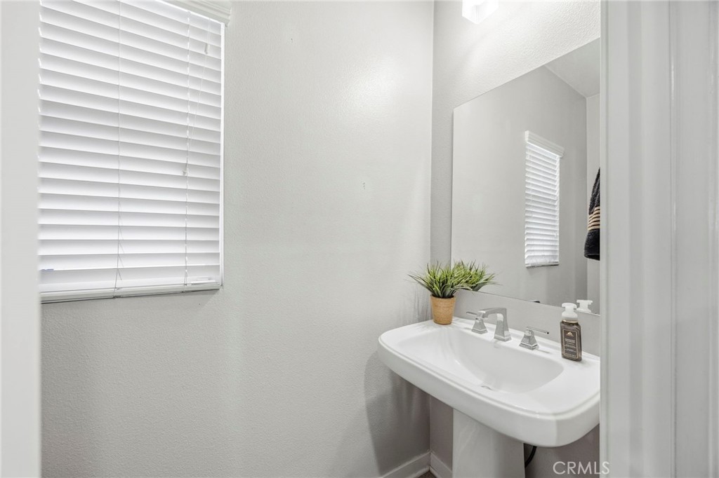 2049 North Orange Olive Road Orange, CA 92865 - Photo 15 of 36 a bathroom with a sink and a mirror