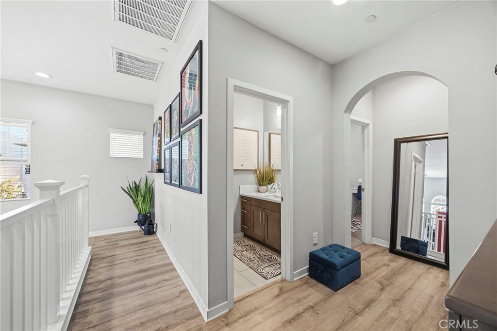 2049 North Orange Olive Road Orange, CA 92865 - Photo 18 of 36 a view of a hallway view with wooden floor and staircase