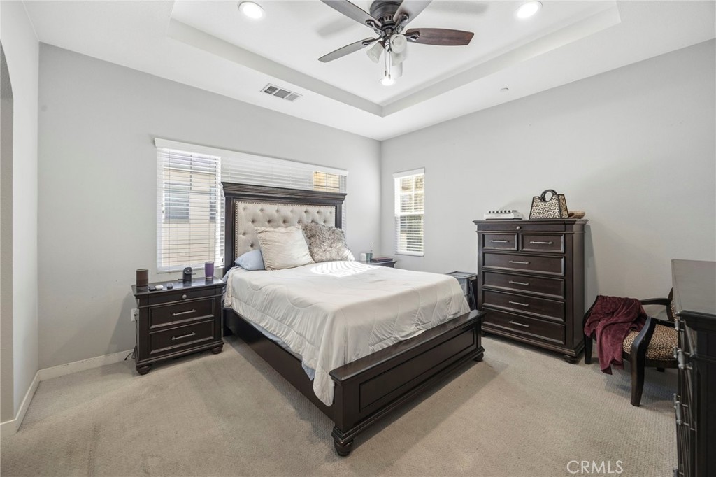 2049 North Orange Olive Road Orange, CA 92865 - Photo 20 of 36 a bedroom with a bed and a chandelier