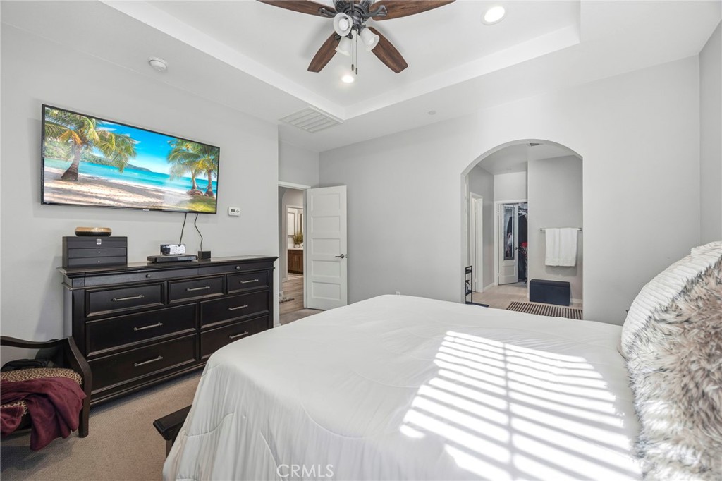 2049 North Orange Olive Road Orange, CA 92865 - Photo 21 of 36 a bedroom with a bed and a flat screen tv