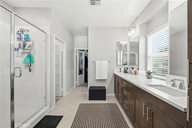 a kitchen with a refrigerator and a sink