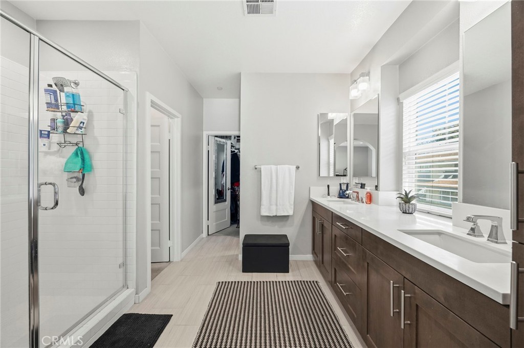 2049 North Orange Olive Road Orange, CA 92865 - Photo 22 of 36 a kitchen with a refrigerator and a sink