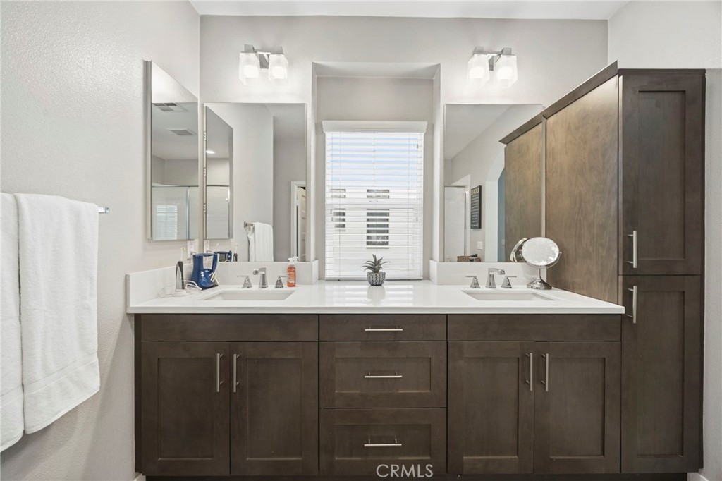 2049 North Orange Olive Road Orange, CA 92865 - Photo 23 of 36 a bathroom with a double vanity sink and a mirror