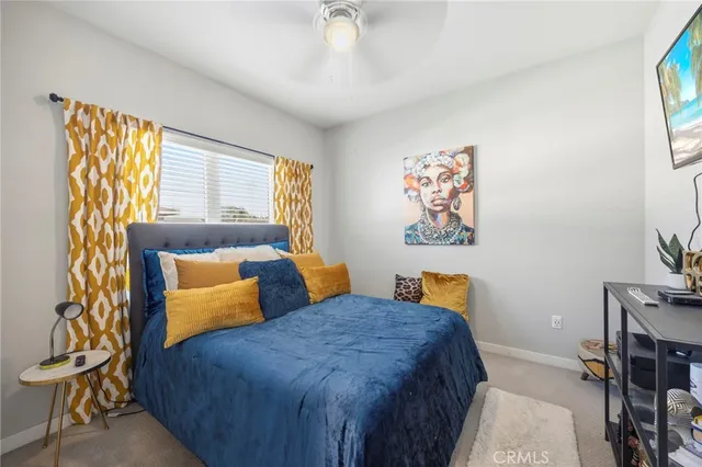 a bedroom with bed and window