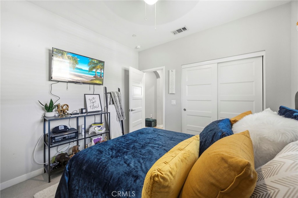 2049 North Orange Olive Road Orange, CA 92865 - Photo 26 of 36 a bedroom with a bed and a flat screen tv