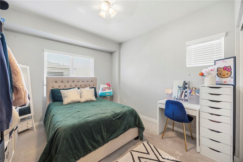 2049 North Orange Olive Road Orange, CA 92865 - Photo 27 of 36 a bedroom with a bed and a chandelier