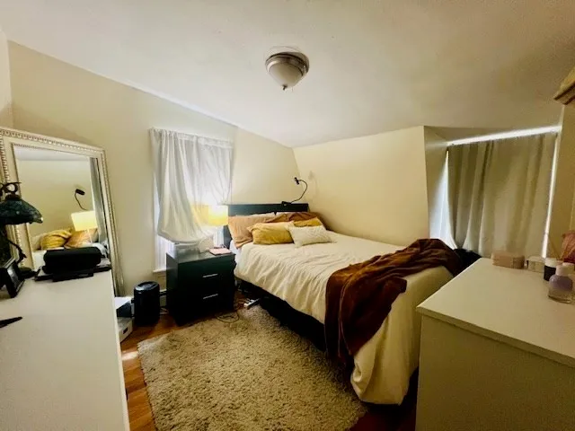 a bedroom with a bed and a walk in closet