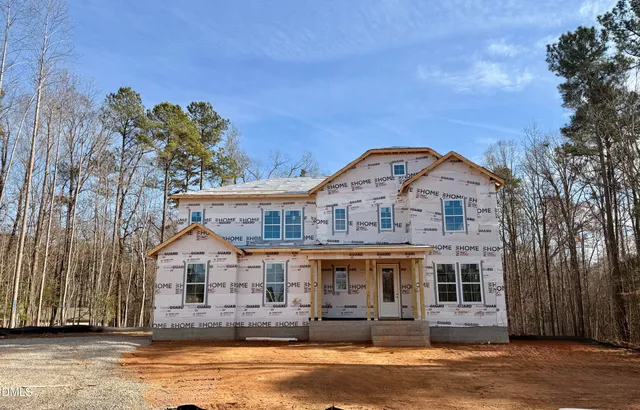 a front view of a house with a ocean view
