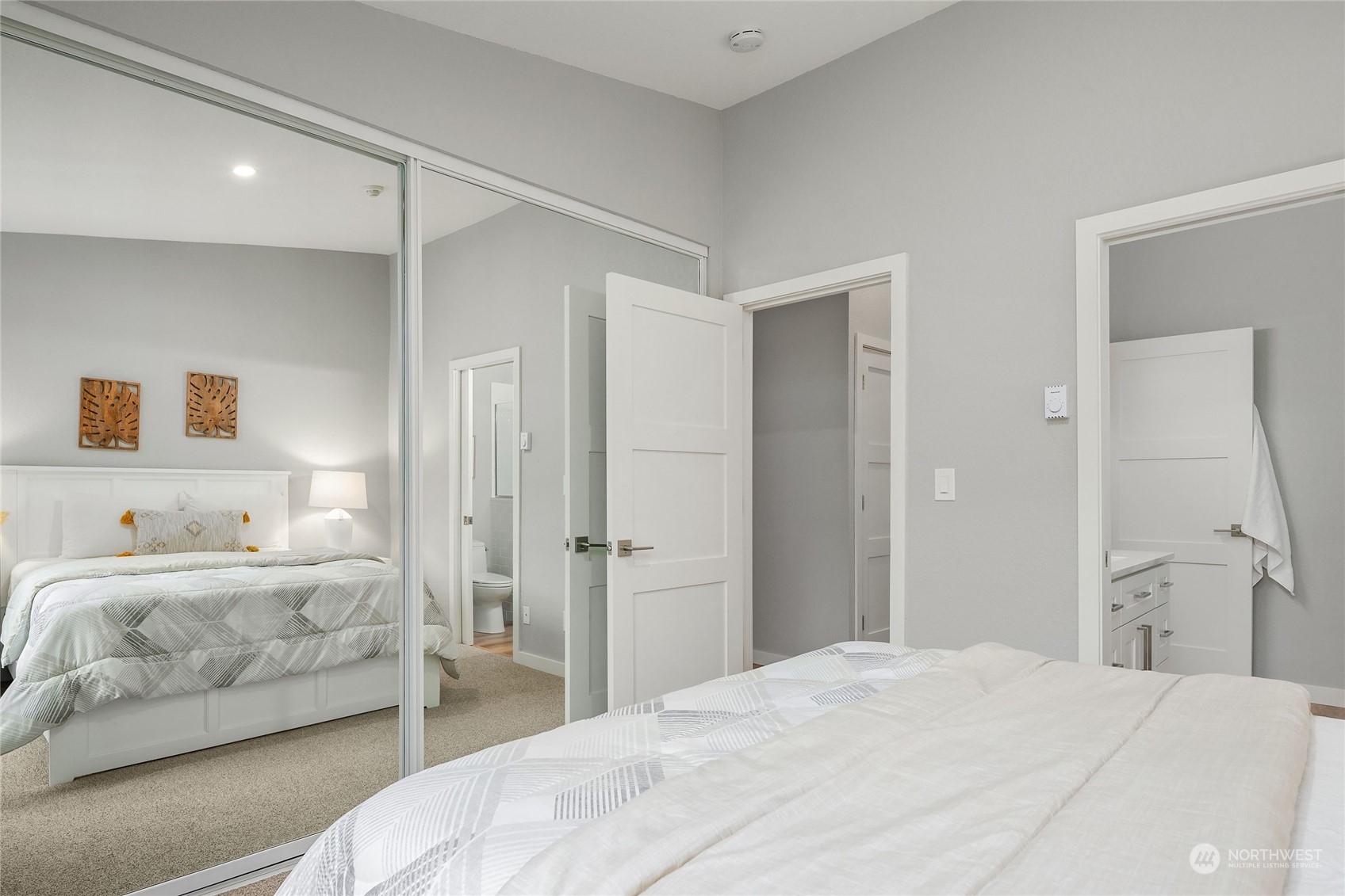 10830 East Riverside Drive, Unit B305 Bothell, WA 98011 - Photo 12 of 21 a bedroom with a bed and a cabinets