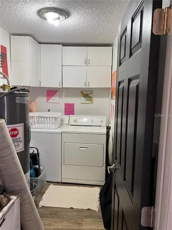 a utility room with cabinets