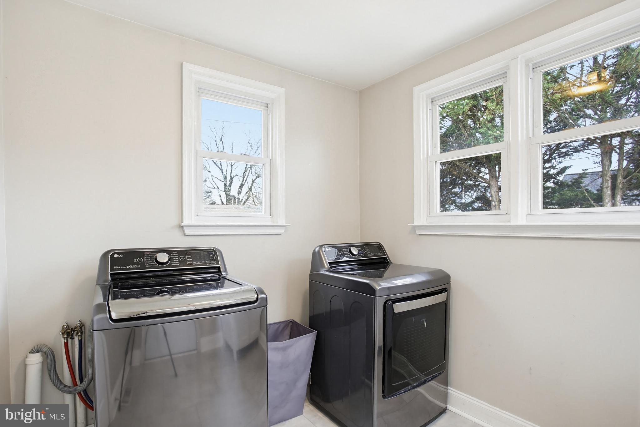 8209 Longpoint Road Baltimore, MD 21222 - Photo 12 of 37 a kitchen with a stove and a microwave