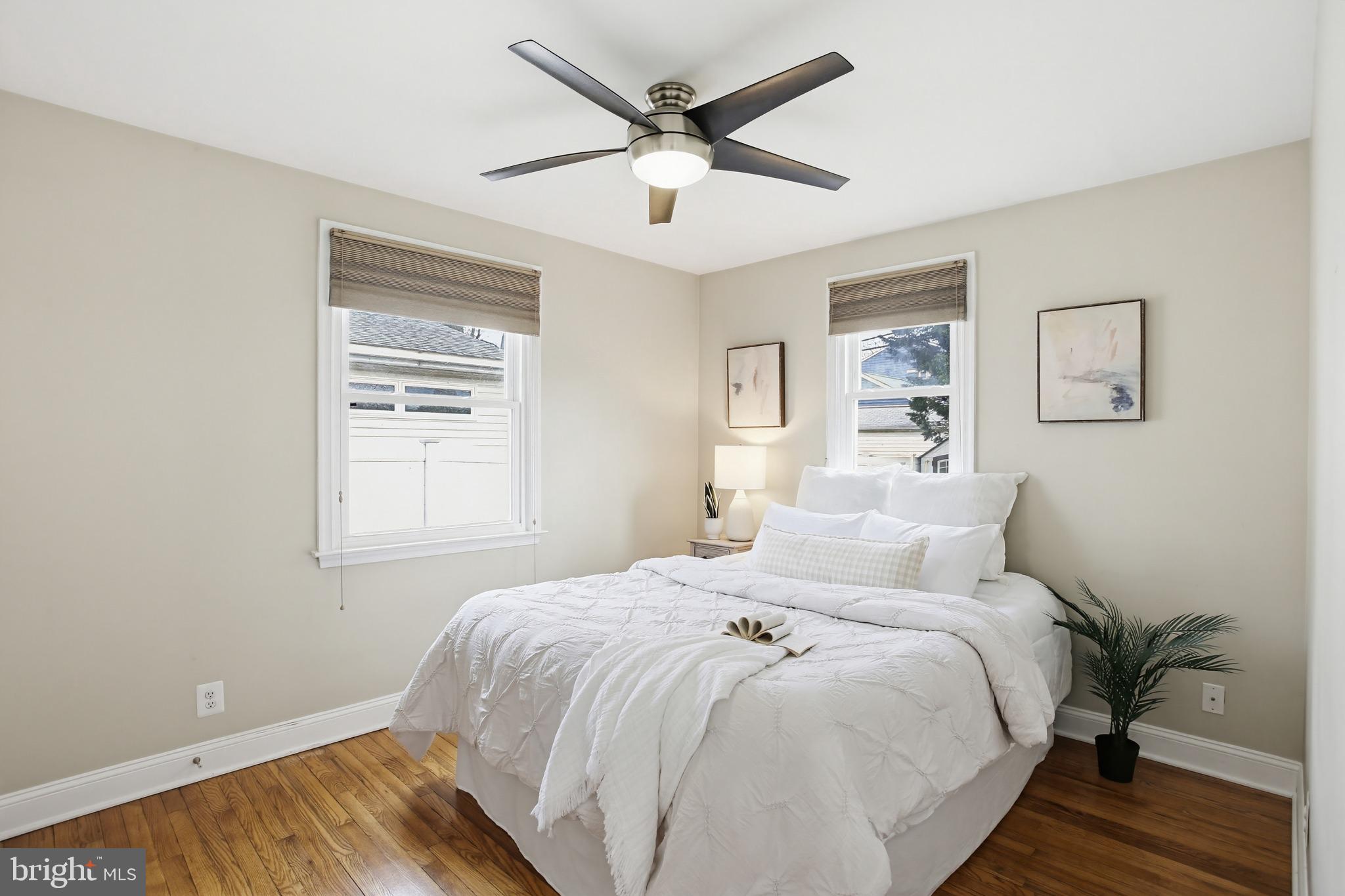 8209 Longpoint Road Baltimore, MD 21222 - Photo 14 of 37 a bedroom with a bed and window