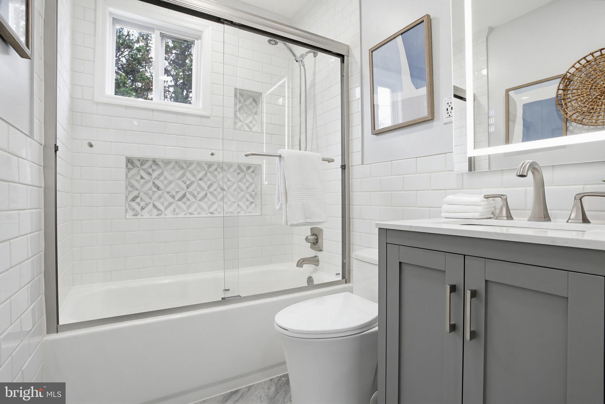 8209 Longpoint Road Baltimore, MD 21222 - Photo 18 of 37 a bathroom with a sink a toilet and shower
