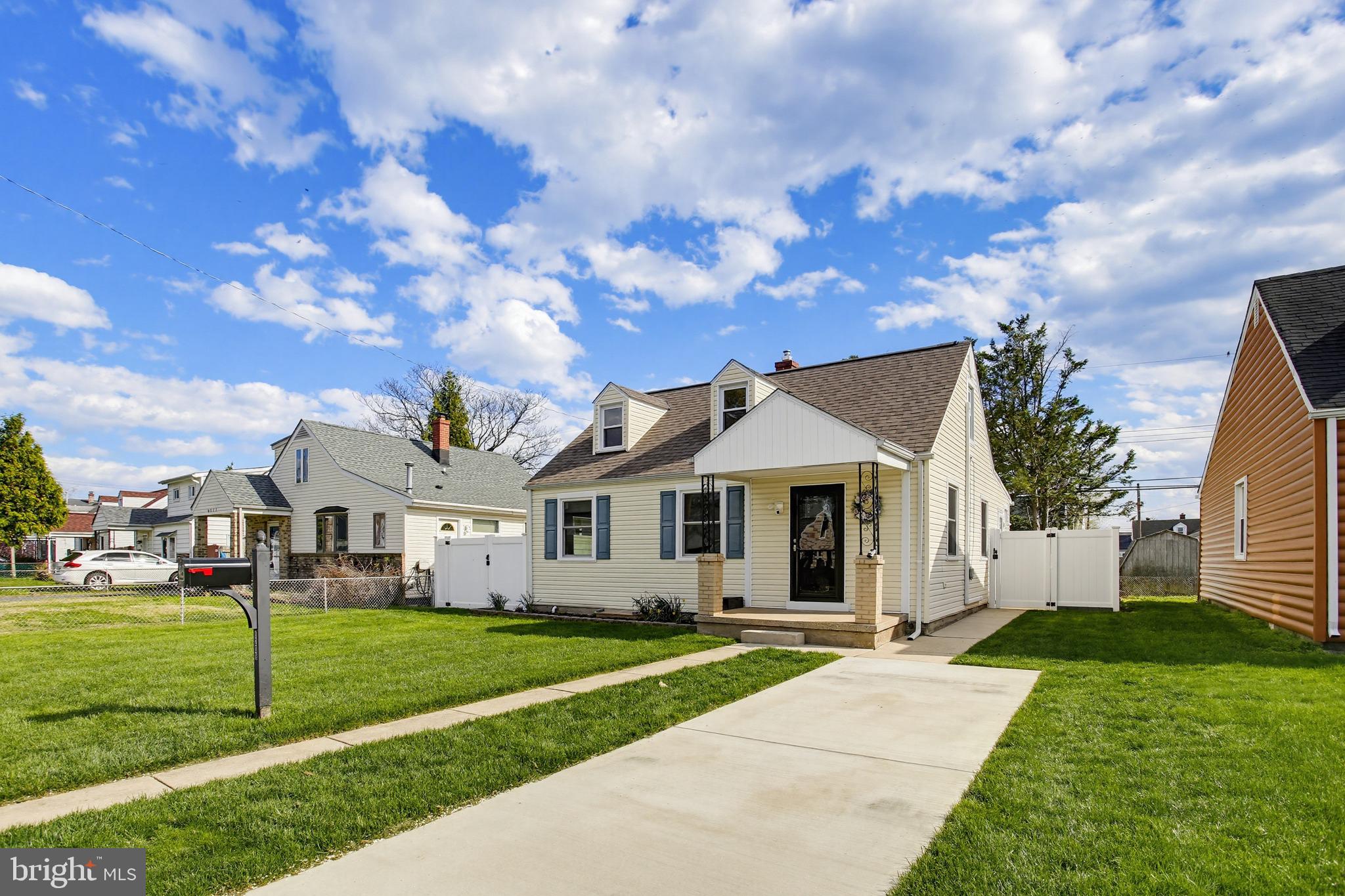 8209 Longpoint Road Baltimore, MD 21222 - Photo 2 of 37 a front view of a house with a yard